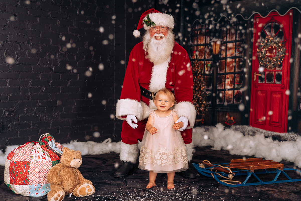 Santa standing with toddler